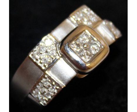 AN 18CT WHITE GOLD AND DIAMOND PANEL RING.