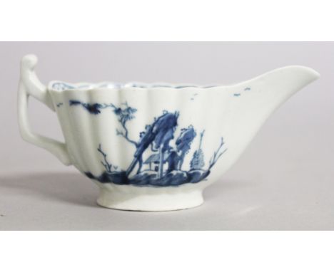 A WORCESTER BLUE AND WHITE RIBBED CREAM BOAT "THE TREEHOUSE", CIRCA. 1760, "VERY RARE". 4.25ins long.