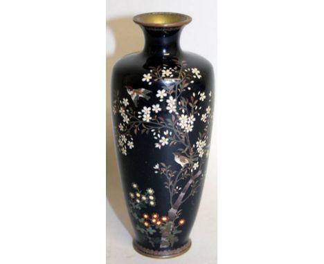 A SMALL JAPANESE BLUE CLOISONNE ENAMEL VASE decorated with birds and flowers. 6ins high.