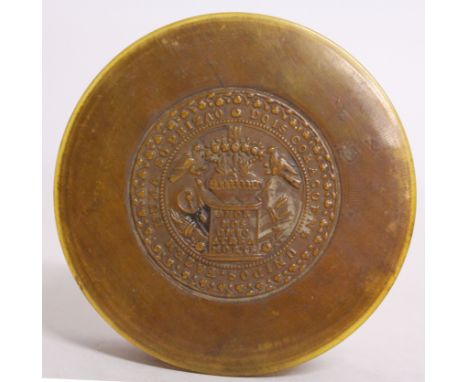 A 19TH CENTURY CARVED HORN CIRCULAR SNUFF BOX, the lid carved with a Latin motto. 3.5ins diameter.