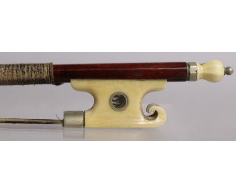 A "VUILLAUME" STYLE VIOLIN BOW with ivory and mother-of-pearl inlaid frog.Please note: John Nicholson does not ship items con