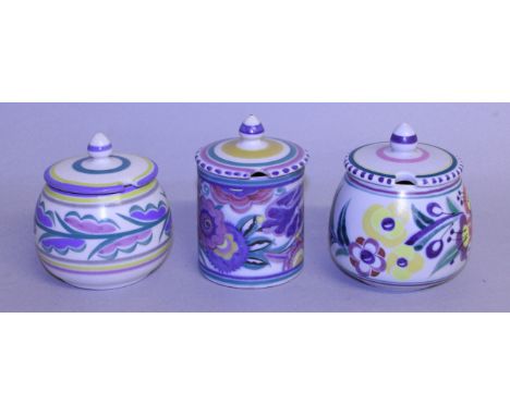 THREE POOLE POTTERY PRESERVE JARS AND COVERS.