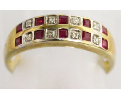 A 9CT YELLOW GOLD RUBY AND DIAMOND DOUBLE ROW RING.