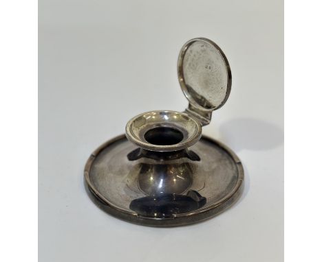 A George V silver capstan inkwell, of characteristic form, hallmarked for Birmingham 1912 (lacking glass liner). Diameter 11.