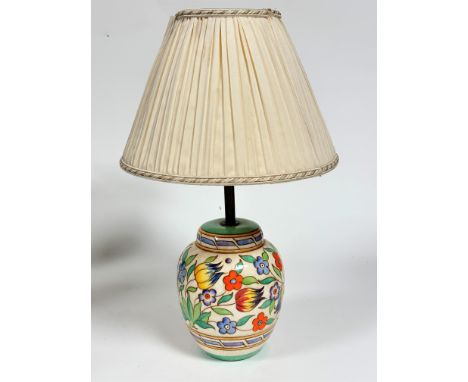 A 1920s/30s pottery ginger jar shaped table lamp base decorated with tulips, cornflowers etc., complete with shade, with tube