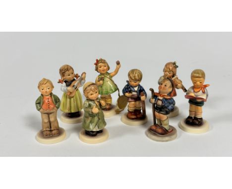 A group of nine miniature Hummel pottery figures including Little Hiker, Honour Student, First Violin, Summertime Surprise et
