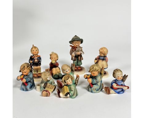 A group of ten various Hummel pottery figures including two Angel candleholders etc. (tallest: 12cm smallest: 6cm)