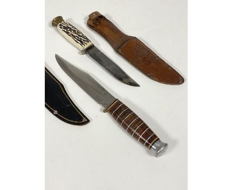 A mid 20th century German Bowie knife, 4" blade stamped Solingen Made in Germany, the handle with simulated antler scales, co