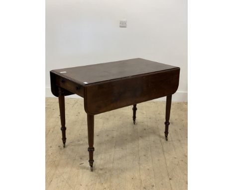 A mid 19th century mahogany Pembroke table, the top with two drop leaves above a drawer opposed by a dummy, raised on ring tu