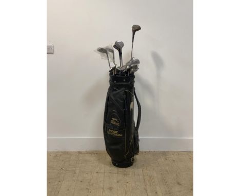 A partial set of Dunlop golf clubs, together with eight other golf clubs by various makers (15) in a slazenger bag