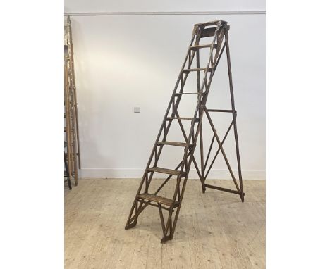 A set of early 20th century pine 7 rung decorators step ladders,  stamped 'Eller brand made in Scotland by disabled soldiers'