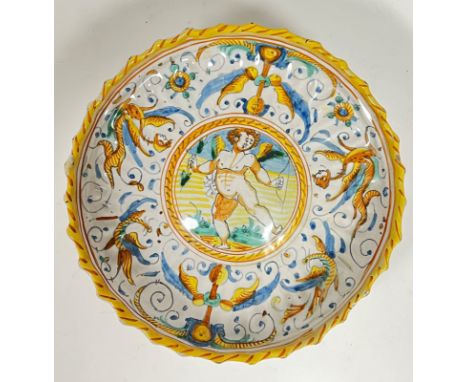 A late 19th century Italian maiolica tin-glazed Istoriato pottery stemmed bowl depicting Cupid in a central roundel, the oute