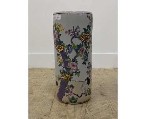 A modern Chinese porcelain cylindrical stick stand, depicting cranes and flowers, painted in polychrome enamels, H46cm