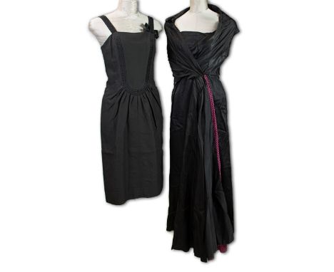 A  1960s black cocktail dress with built in sash in black and pink, Size 8, together with a 1960s black cocktail dress, Size 