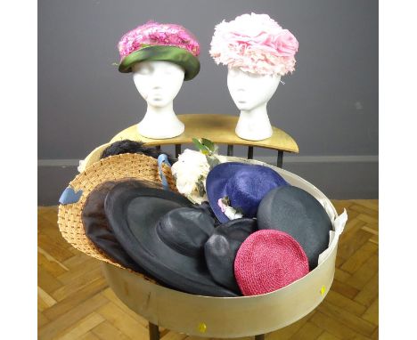 An assortment of ladies vintage floral and pill box hats