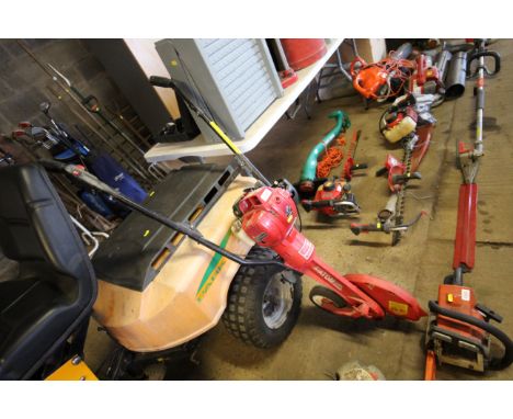 A Honda Deluxe Atom lawn edger with petrol four stroke engine 