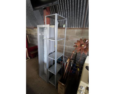A tall aluminium shelf unit comprising five shelves 