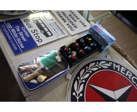 A cased set of table tennis bats, net and balls; a boxed set of carpet bowls and a small Whirlwind pulley