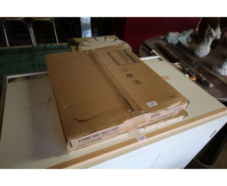 Three boxes of three door robe shelf packs 