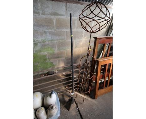 A large heavy metal tool and a vintage jack