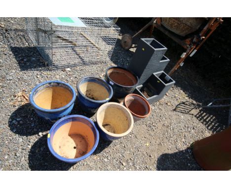 A graduated four tier planter; together with six glazed planters
