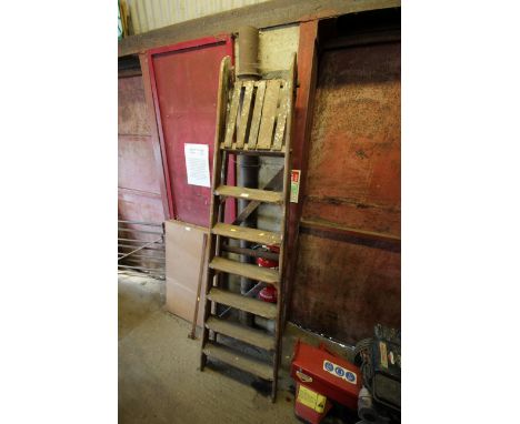 A wooden folding step ladder