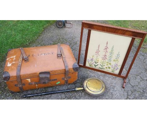 A leather covered travelling trunk, together with a mahogany framed fire screen with tapestry panel to both sides and an anti