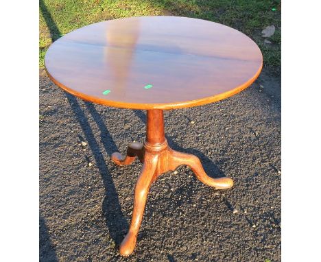 An Antique mahogany circular table, with bird cage action, on a tripod base, diameter 28ins, height 27ins