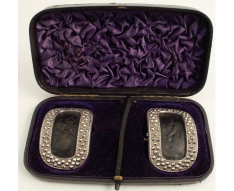 A pair of Georgian cased cut steel shoe buckles, with leather backs, marked L and R