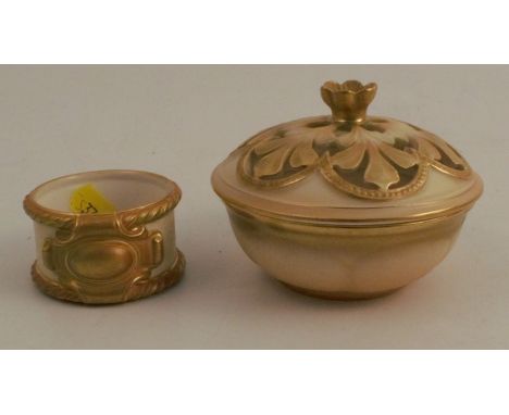 A Royal Worcester gilded ivory covered bowl, the pierced cover decorated with a flower finial and leaves, shape number G890, 