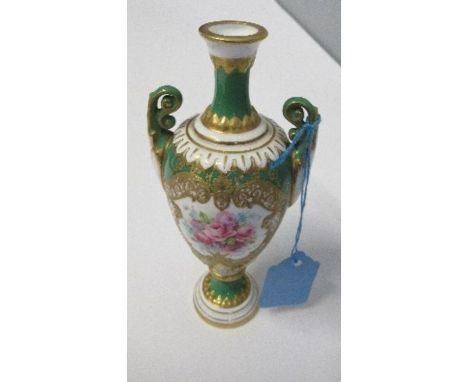 A Royal Worcester vase, decorated with a green ground, to gilt and ivorine, reserving a floral panel of roses,&nbsp;by Ernest