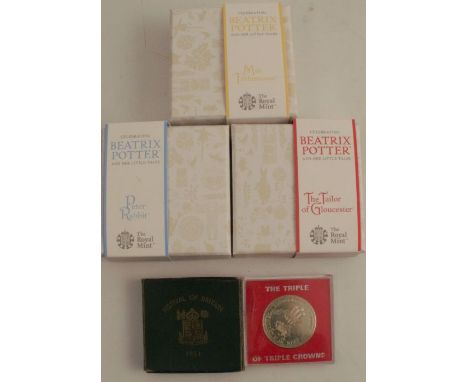 The Royal Mint, three cased Beatrix Potter 50p coins with enamel decoration, The Tailor of Gloucester, Mrs Tittlemouse and Pe