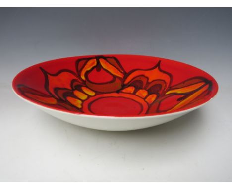 A LARGE POOLE POTTERY DELPHIS PATTERN BOWL, shape 58, decorated in tones of yellow, orange and red, printed mark, approx. Dia