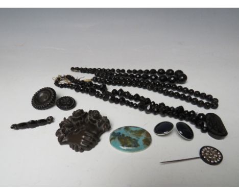 A RUSKIN OVAL CERAMIC PANEL AND TWO RUSKIN BUTTONS, all with impressed marks to reverse, together with a selection of jet and