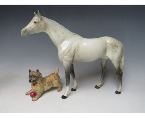 A BESWICK CERAMIC BOIS ROUSSEL RACEHORSE FIGURINE IN DAPPLE GREY, together with a Beswick Cairn Terrier (2)