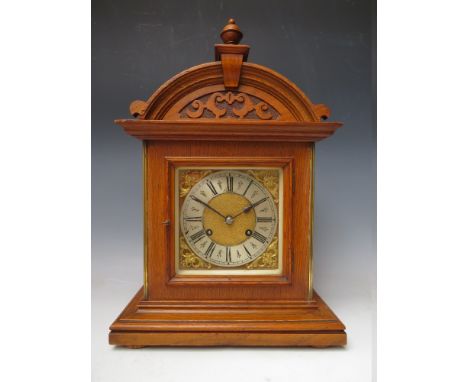 AN OAK CASED 8 DAY 'TING TANG' STRIKE MANTLE CLOCK, the dial with silvered chapter ring, Roman numerals and corner spandrels,