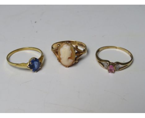 THREE 9CT GOLD LADIES DRESS RINGS, comprising a cameo ring size R, a tanzanite ring size T and a pink gemstone and diamond se