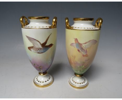 A SMALL PAIR OF MINTONS CABINET VASES, each decorated with game birds, both signed by J E Dean, printed mark to the bases, H 