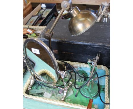 An angle poise lamp, chrome swing mirror and an apple peeler