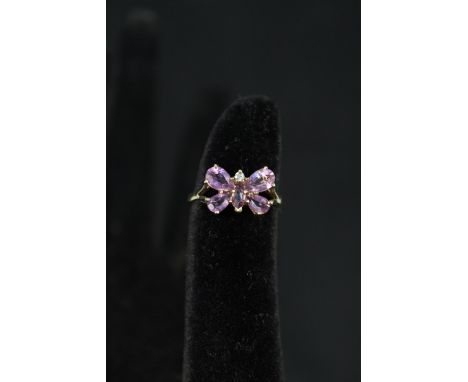 A 9ct gold ring set with amethyst and small diamond in butterfly form, size K