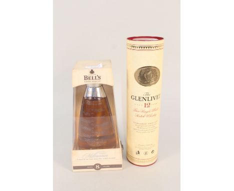 A bottle of Glenlivet single malt 12 year whisky, a boxed Millennium 2000 plus boxed Courvoisier cognac
