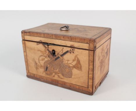A 19th Century satinwood inlaid and cross banded tea caddy with leaf and musical trophy inlays