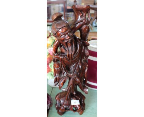 A Chinese hardwood carved table lamp of a fisherman, height 19"