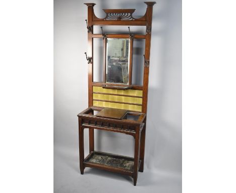 An Art Nouveau Tile and Mirror Back Hall Stand with Centre Glove Compartment Having Hinged Lid, Metal Liner and Six Coat Hook