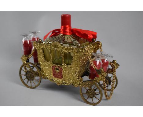 A Continental Novelty Gilt Metal Musical Tantalus in the Form of Cinderella's Carriage, Complete with Six Glasses and Decante