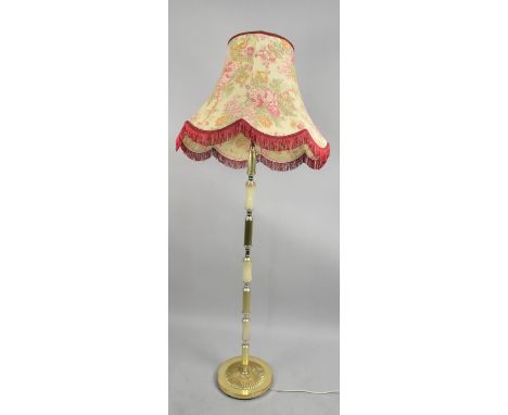 A Brass and Onyx Standard lamp and Shade 