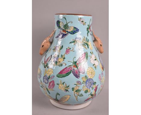 A Chinese Vase of Hu Form Decorated in the Famille Rose Palette with Butterflies and Flowers on Light Blue Ground, Twin Stag 