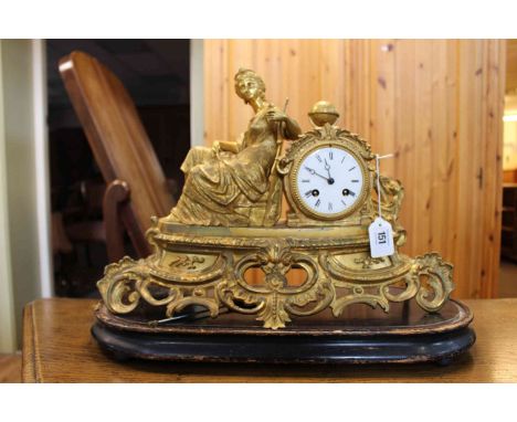 19th Century gilt metal mantel clock with figure mount and enamel dial