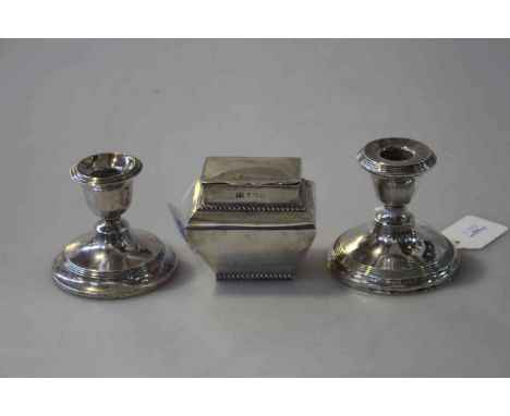 Silver caddy and a pair of candlesticks