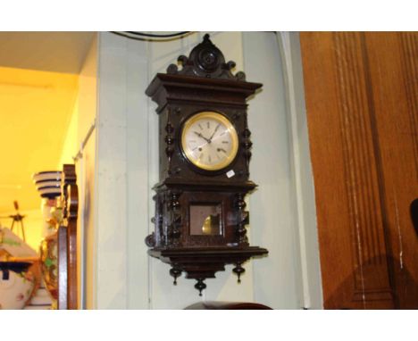 Late 19th Century stained oak cased wall clock having silvered dial signed W. Potts
